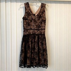 Bellatrix brand skater dress in black lace with nude underlay, size M.